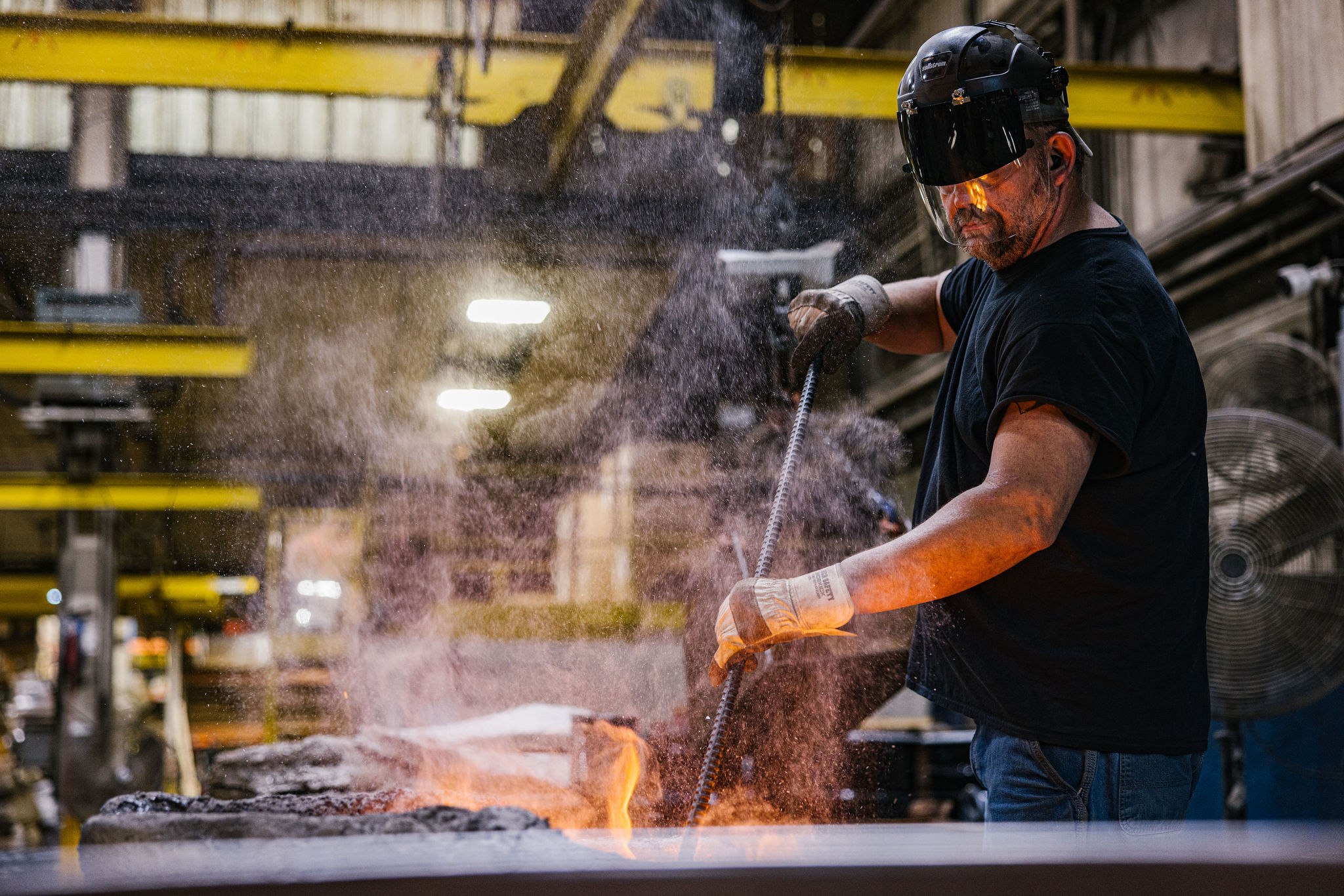 A 3D-printed sand mold immediately after pouring — the same patternless workflow supports both CA6NM and CA15 martensitic stainless castings on 1-to-100-piece runs.